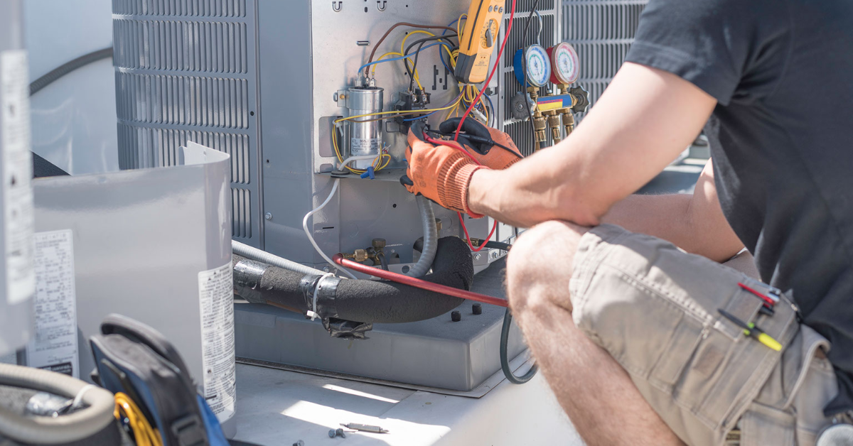 AC repairman preforming maintenance on an outside unit - Accurate Air and Heat - AC Repair Lake Charles La