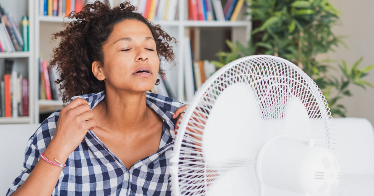 Image of a woman inside her home sitting in front a table fan - Accurate Air and Heat, LLC - AC Repair Lake Charles La